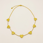 Collar Multicorazones Acero Martina con fondo blanco humo cálido